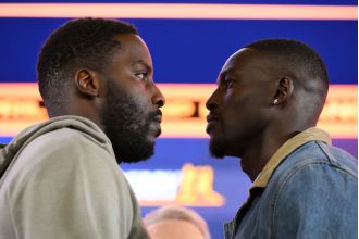 A British boxer mocks his opponent for allegedly kissing Madonna during a heated exchange.