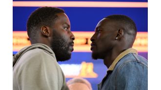 A British boxer mocks his opponent for allegedly kissing Madonna during a heated exchange.