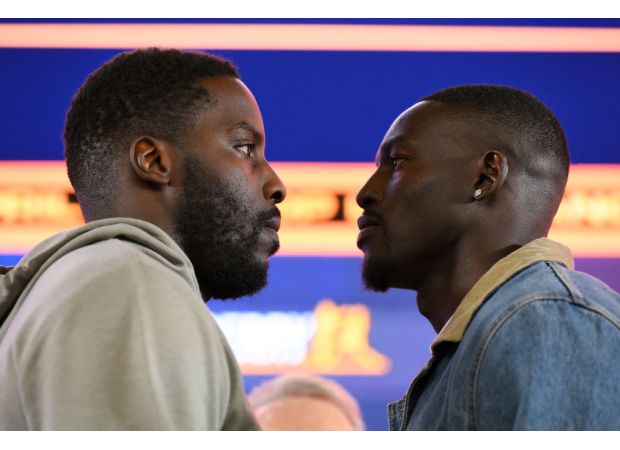 A British boxer mocks his opponent for allegedly kissing Madonna during a heated exchange.