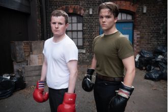 Who portrays the young versions of Phil and Grant Mitchell on EastEnders?