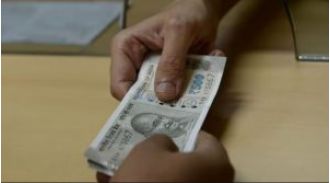 Odisha officials caught accepting bribes during vigilance operation.