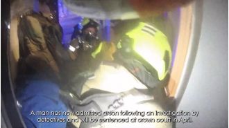Brave police officer enters blazing home to rescue woman following arson assault.