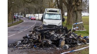 Residents of 'caravan city' defend themselves with weapons after an act of arson.