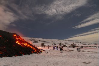 Adventurous travelers ignore Italy's warning and ski on an active volcano.