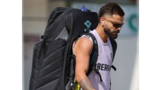 Cricket star Kohli prepares for Pakistan match by practicing spin skills.