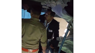 A police officer is caught by a train inspector in a viral video. Watch it now.