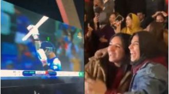 Pakistani fans in Islamabad excitedly support Virat Kohli's 51st ODI century against their team.