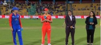 Delhi Capitals choose to bowl first against Gujarat Giants in a WPL match.