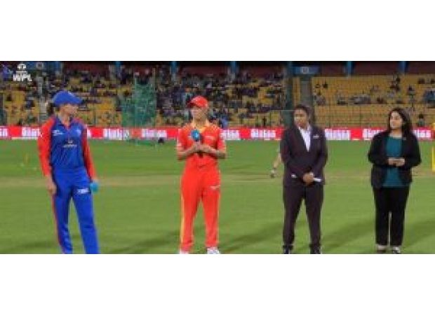 Delhi Capitals choose to bowl first against Gujarat Giants in a WPL match.