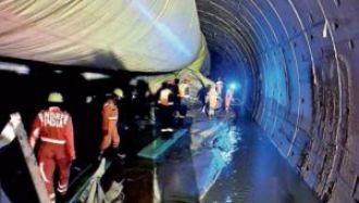 Rescue team reaches end of Telangana tunnel, fate of trapped workers still unknown.