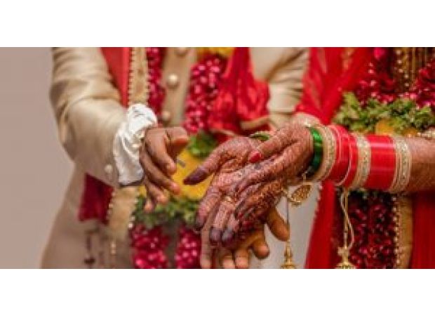 Couple gets married in hospital, leaving wedding attendees emotional.