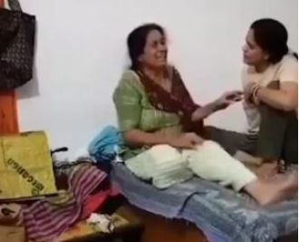 A video shows a daughter hitting and biting her mother after slapping her.