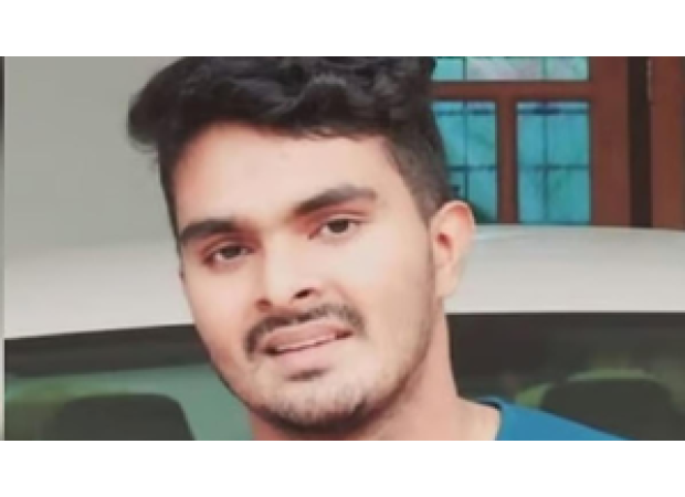 Affan's father falls to the ground overcome with sadness as he visits his son's and other relatives' graves.