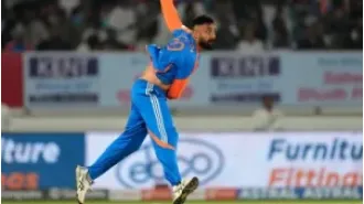 India secures top spot in Group A after defeating New Zealand and will face Australia in the semi-finals of the Champions Trophy.