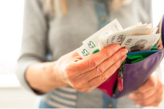 Find out the minimum income required to be considered wealthy in different regions of the UK.
