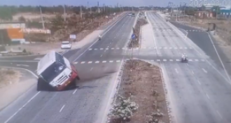 Biker's dangerous actions cause bus to overturn, then leaves without any concern.