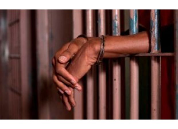 A local official was arrested for forcibly removing a woman's clothes on a village road in Kendrapara.