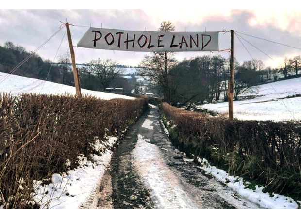 Local governments must repair potholes or risk losing funding for road maintenance.