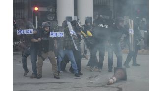 Trump's squad uses flash grenades against protestors during immigration raid.