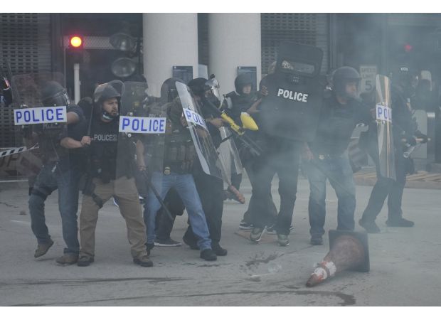 Trump's squad uses flash grenades against protestors during immigration raid.