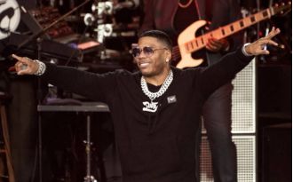 Nelly still denies support for Trump, claims performance doesn't equal endorsement.