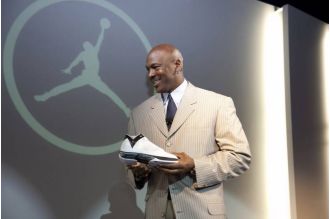 Signed Michael Jordan rookie card from '86-'87 Fleer sells for record-breaking $2.5M.