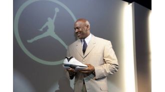 Signed Michael Jordan rookie card from '86-'87 Fleer sells for record-breaking $2.5M.