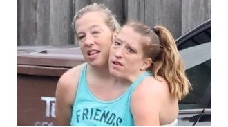 Conjoined twins Abby and Brittany share cryptic update after being seen with a baby.