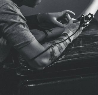 6-year-old designs tattoo for Atlanta artist; unique collaboration results in permanent body art.