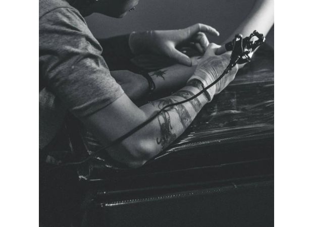 6-year-old designs tattoo for Atlanta artist; unique collaboration results in permanent body art.