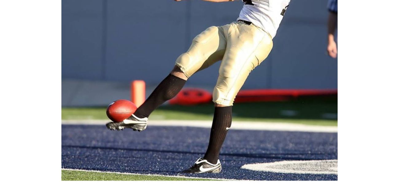 Tuskegee kicker receives backlash for kicking ball at Alabama State marching band during game.
