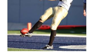 Tuskegee kicker receives backlash for kicking ball at Alabama State marching band during game.