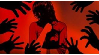 A woman was sexually assaulted by a group of men and two suspects have been apprehended.