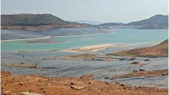 NALCO's red mud pond causes sadness for villagers due to damage and pollution caused by the waste.