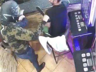 Bar employees mistook a machete-wielding robber for a jokester neighbor and laughed at him.