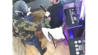 Bar employees mistook a machete-wielding robber for a jokester neighbor and laughed at him.