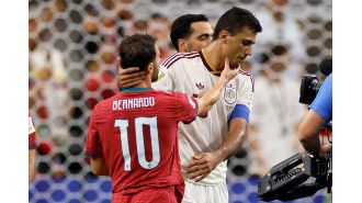 Rodri reaches out to Bernardo Silva following their encounter in the Man City legends match during the World Cup.