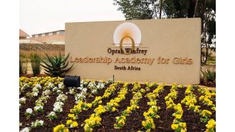 Oprah Winfrey will shut down her South Africa girls' school and increase scholarship opportunities.