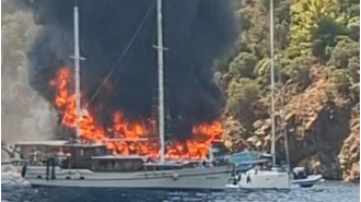 Over 100 people jump off burning boat during children's tour amid intense fire.