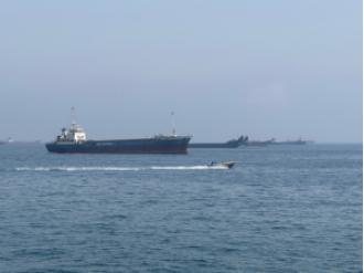 Two oil tankers from UAE struck while passing through Hormuz, according to a report.