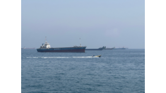 Two oil tankers from UAE struck while passing through Hormuz, according to a report.