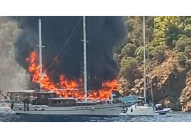 Over 100 people jump off burning boat during children's tour amid intense fire.