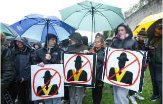 Protesters face off with police as Orange Order parade is postponed.