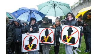 Protesters face off with police as Orange Order parade is postponed.