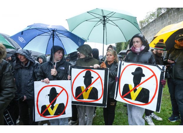 Protesters face off with police as Orange Order parade is postponed.